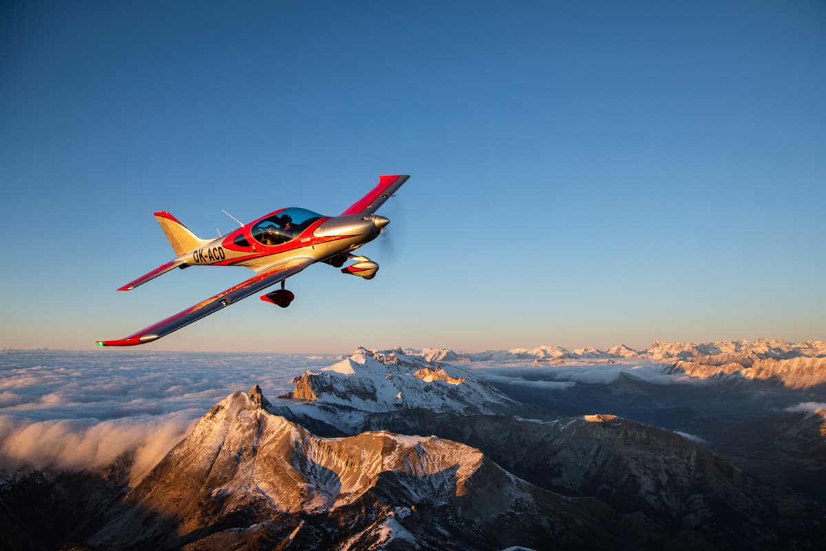 Bristell B23 Mosaic over the Alps under a clear sky