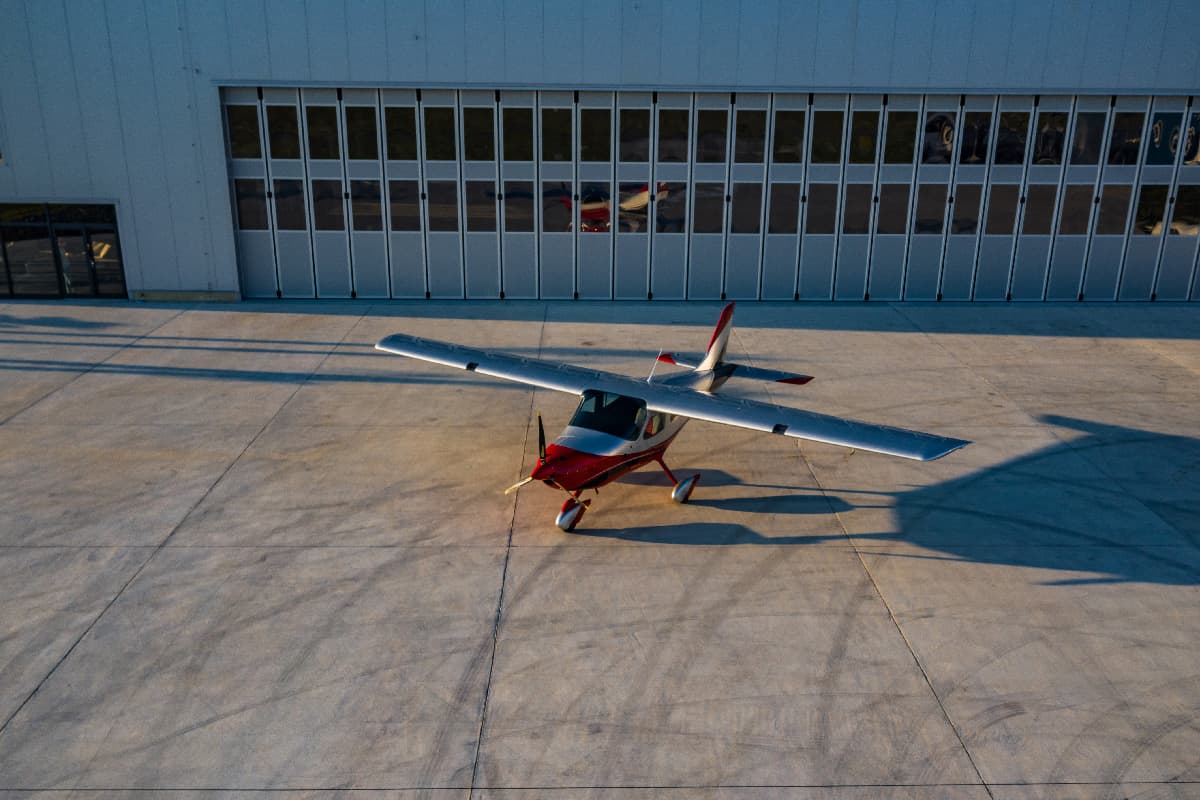 Bristell B8M parked on the apron in front of the hangar