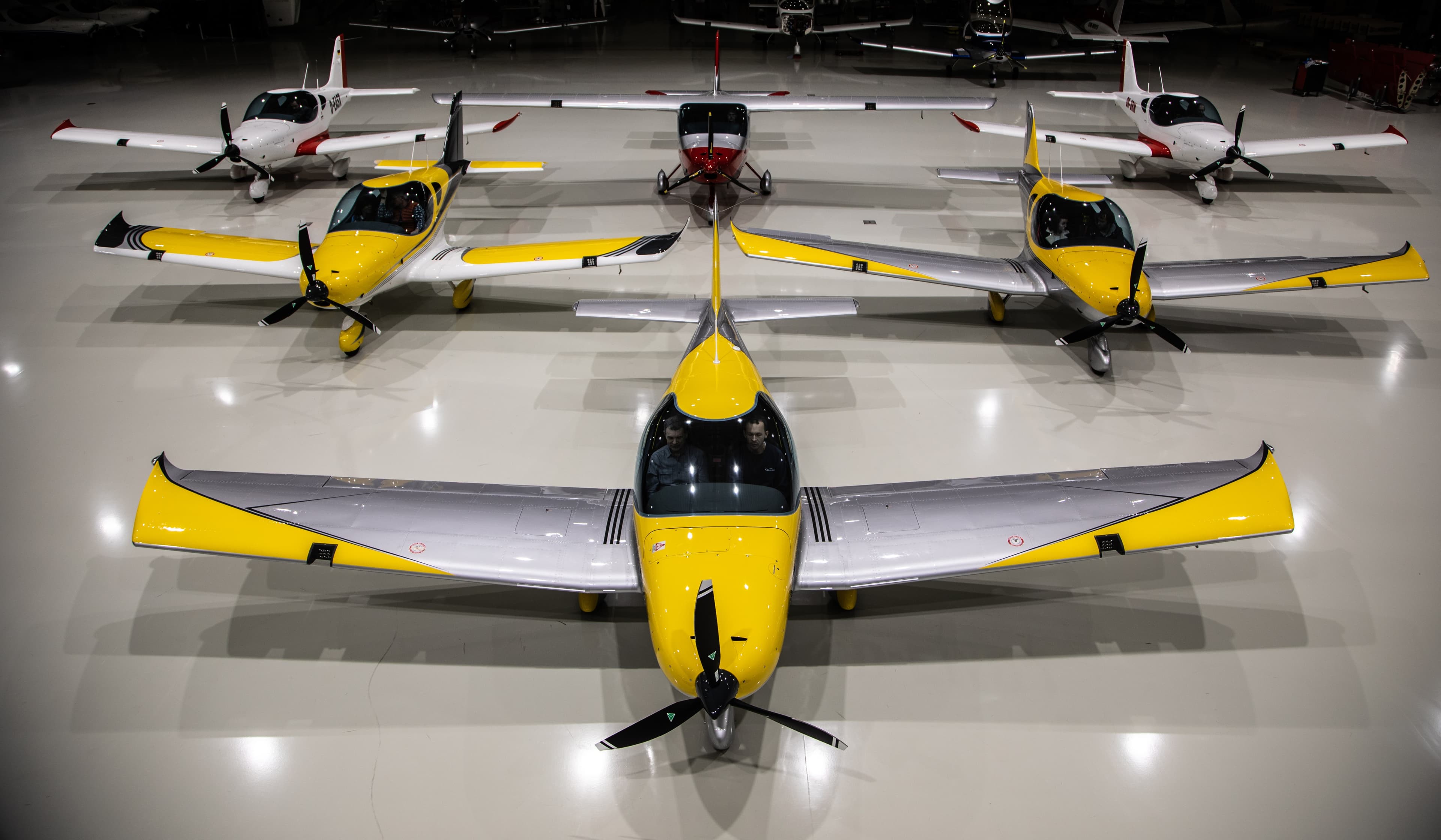 The Golden Wings Team fleet of Bristell aircraft lined up in the hangar