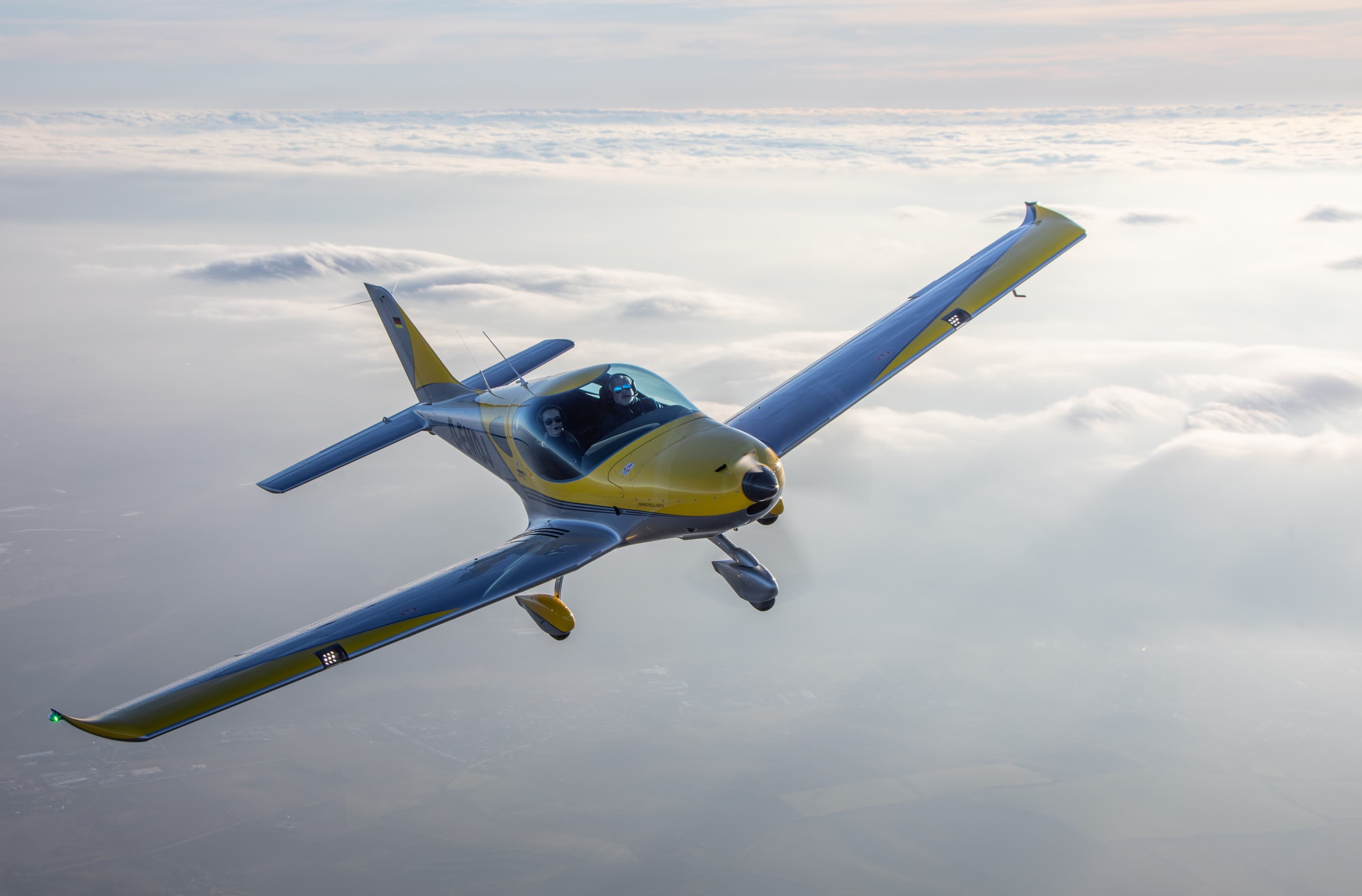 A Bristell aircraft from the Golden Wings Team fleet cruising above the clouds